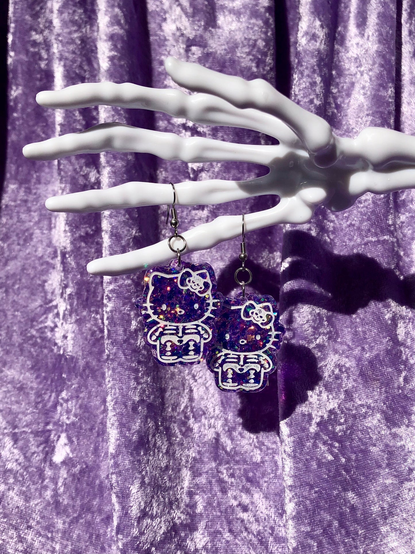 Skeleton Kitty Earrings - Purple Glitter