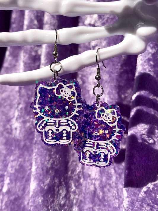 Skeleton Kitty Earrings - Purple Glitter